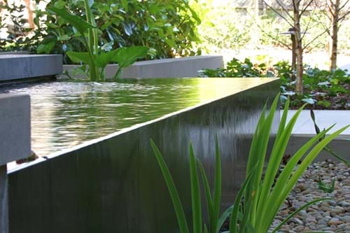 Spillover water feature with bluestone